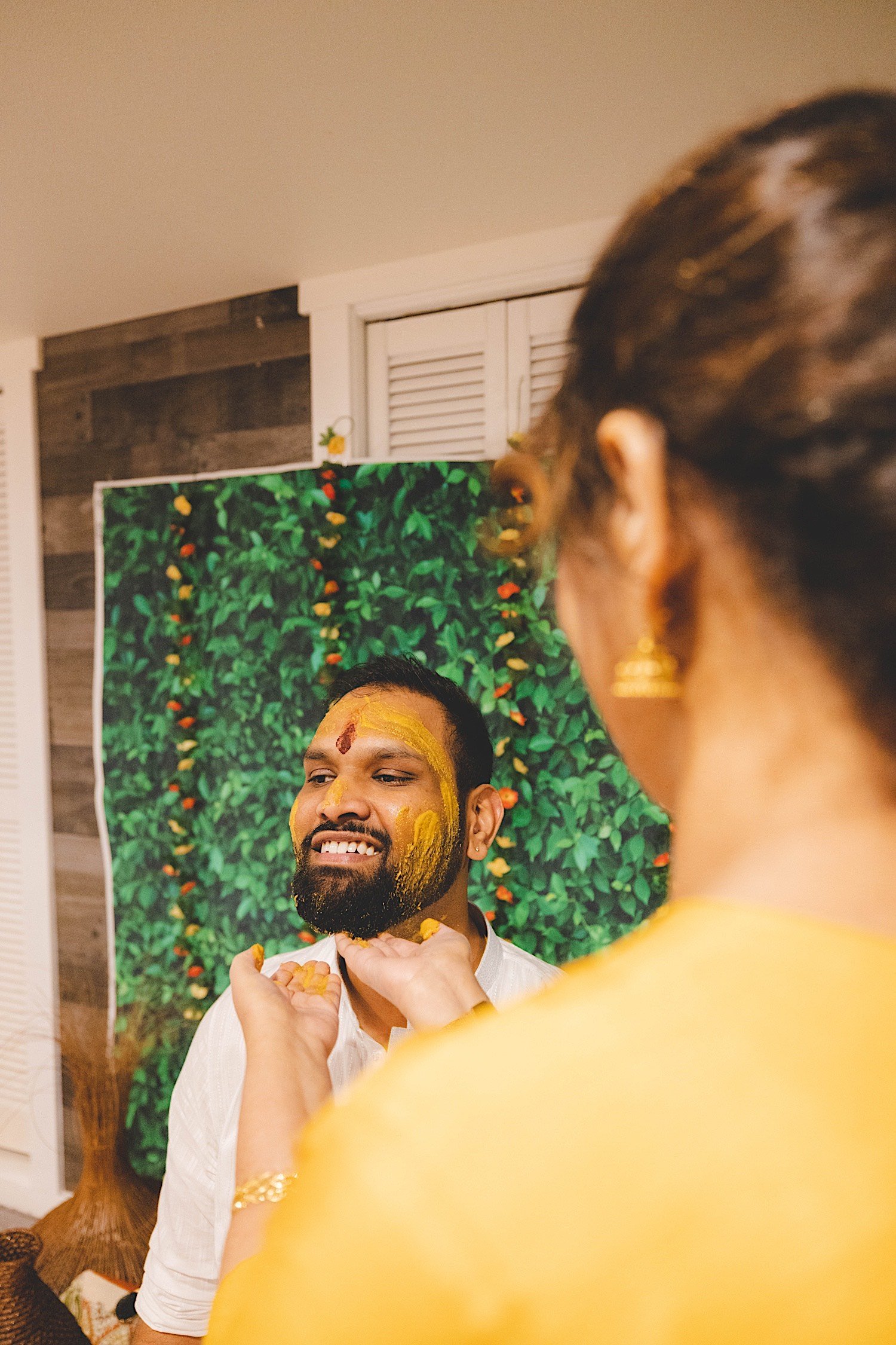 Groom gets turmeric spread across his face during traditional Haldi celebration