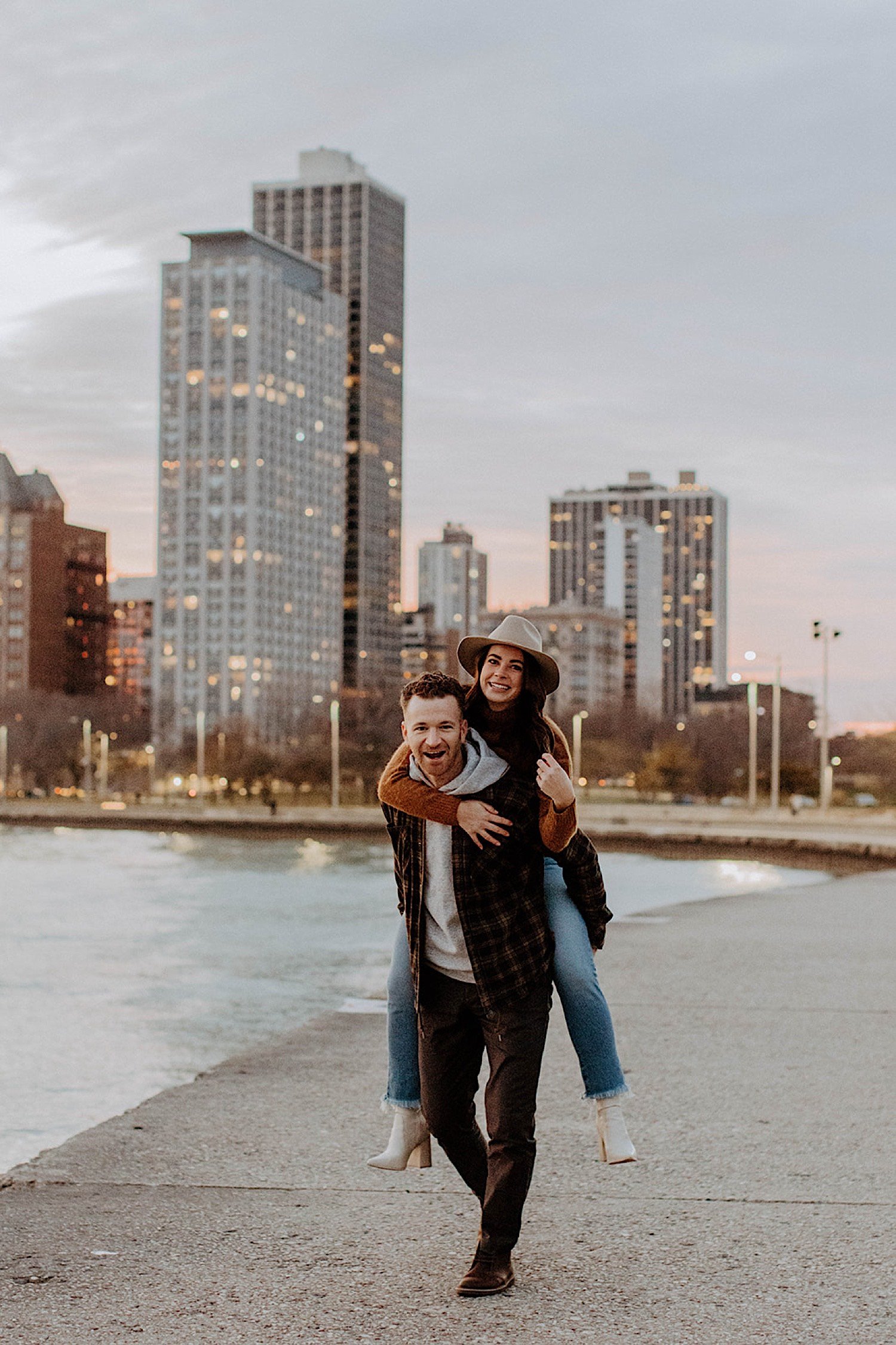 Man gives his fiancé a piggy back ride on Chicago's North Avenue Beach