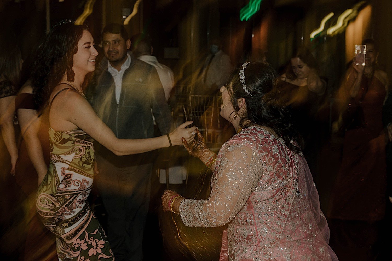 Bride dances with friend at Rosehill Community Center wedding reception