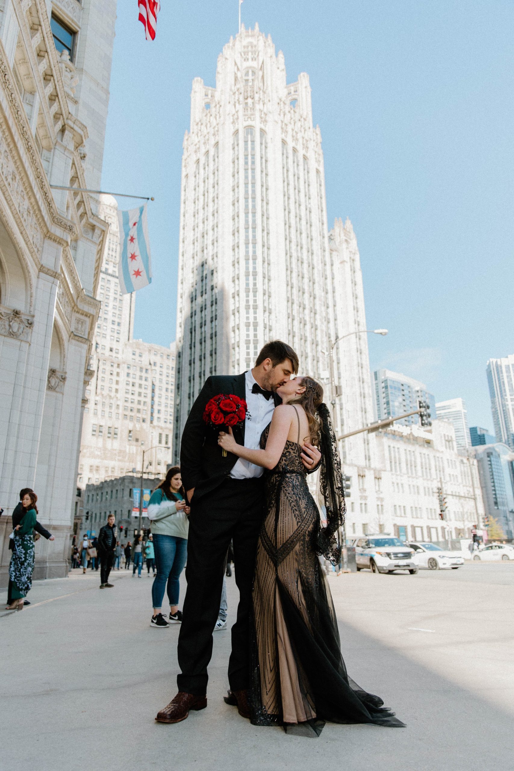 Couple dressed in black kiss in downtown Chicago