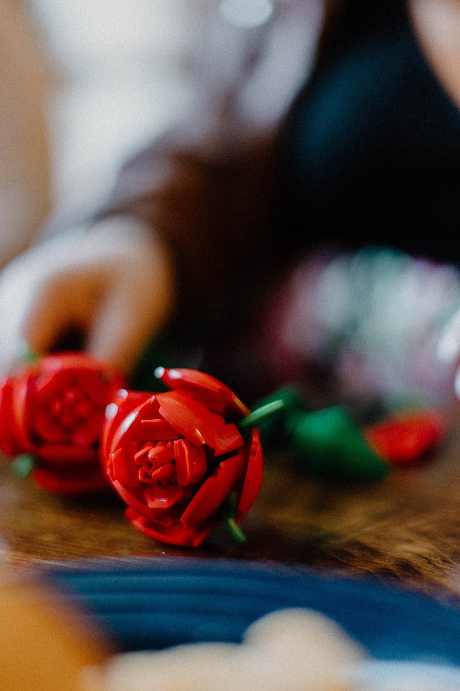 Lego roses on a table in a restaurant